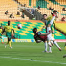 Chris Wood of Burnley scores his team's first goal during the Premier League match between Norwich City and Burnley FC at Carrow Road on July 18, 2020 in Norwich, England.