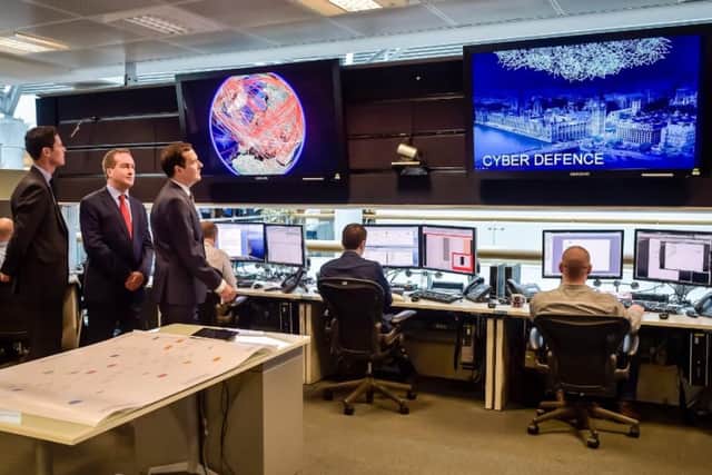 Work on cyber defence at GCHQ in Cheltenham during a visit by former Chancellor George Osborne.