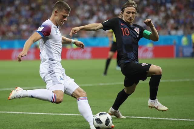Johann Gudmundsson of Iceland in action with Luka Modric of Croatia during the 2018 FIFA World Cup Russia group D match between Iceland and Croatia at Rostov Arena on June 26, 2018 in Rostov-on-Don, Russia.