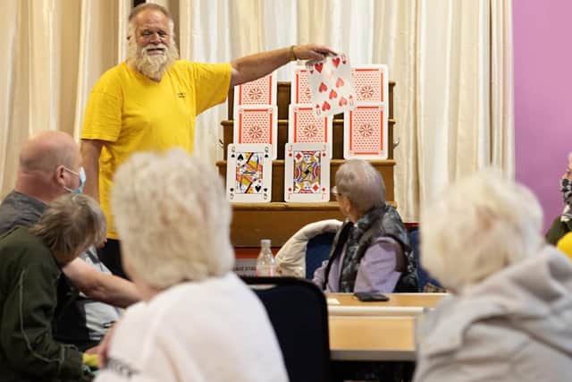 Members of the Burnley and District Society for the Blind and Visually Impaired are all set for a game of Play Your Cards Right