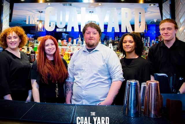 The Coal Yard staff who launched the fund raising campaign for a defibrillator (left to right)  Hannah Harrison (bartender) Caitlin Hanley (assistant manager) Jake Allen (manager)  Lia Babatunde and John Adam (bartenders) 

(Photo by Shannon Louise of John Weston Photography)