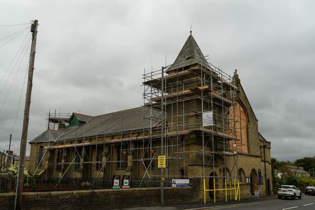 Clad in scaffolding for the repair work to be carried out, St Catherine's Church in Todmorden Road, Burnley