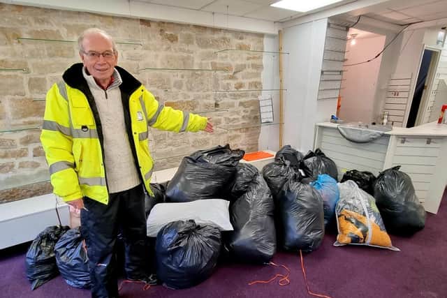 Rotarian Peter Spencer with bags full of coats collected recently at a market stall collection. Picture by David Bleazard