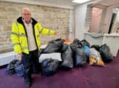 Rotarian Peter Spencer with bags full of coats collected recently at a market stall collection. Picture by David Bleazard