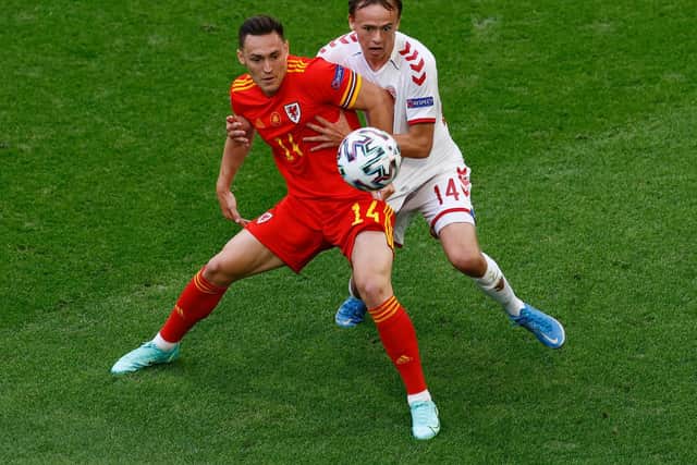 Connor Roberts of Wales battles for possession with Mikkel Damsgaard of Denmark during the UEFA Euro 2020 Championship Round of 16 match between Wales and Denmark at Johan Cruijff Arena on June 26, 2021 in Amsterdam, Netherlands.