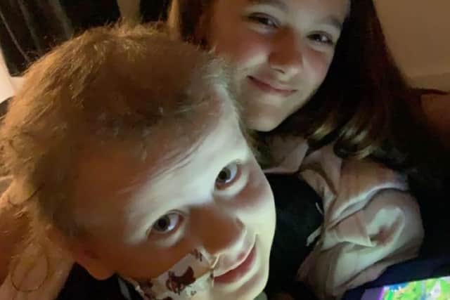 Declan with his sister Katie who is 13