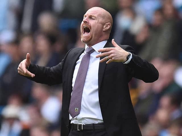 Burnley's English manager Sean Dyche gestures from the touchline during the English Premier League football match between Manchester City and Burnley at the Etihad Stadium in Manchester, north west England, on October 16, 2021.