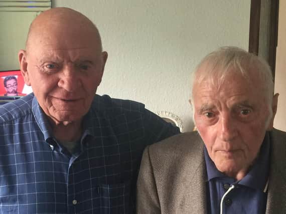 Dennis Sanderson (right) with his late brother, Mark and Howard's father, Les.