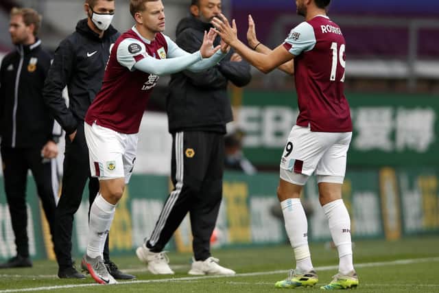 Burnley's Czech striker Matej Vydra (L) replaces Burnley's English striker Jay Rodriguez during the English Premier League football match between Burnley and Wolverhampton Wanderers at Turf Moor in Burnley, north-west England on July 15, 2020.