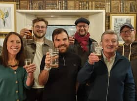 The steering group raise a glass