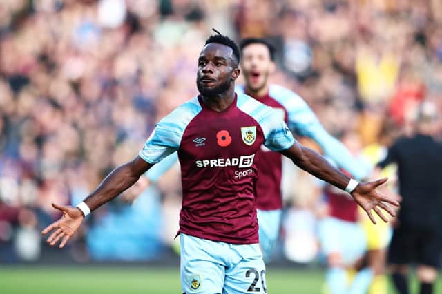 Maxwel Cornet of Burnley celebrates after scoring their team's third goal during the Premier League match between Burnley and Brentford at Turf Moor on October 30, 2021 in Burnley, England.