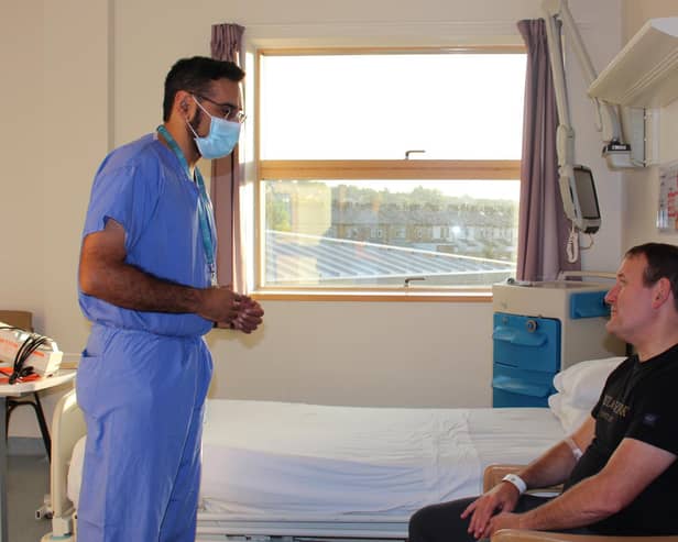 ELHT operating surgeon Mr Choudry meets with Andrew Cook.
