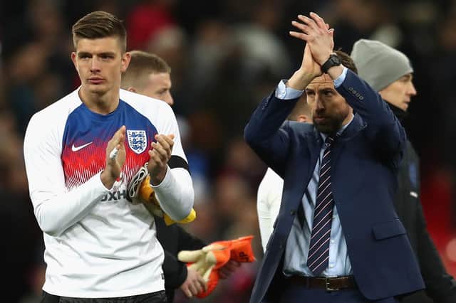 Nick Pope of England and Gareth Southgate manager of England show appreaction to the fans after the International friendly between England and Italy at Wembley Stadium on March 27, 2018 in London, England.