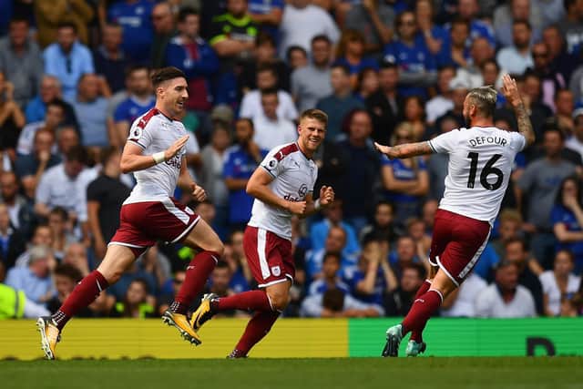 Stephen Ward of Burnley celebrates scoring his sides second goal with Steven Defour of Burnley during the Premier League match between Chelsea and Burnley at Stamford Bridge on August 12, 2017 in London, England.