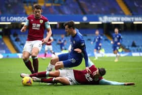 Burnley's English defender Matthew Lowton (R) vies with Chelsea's English midfielder Mason Mount during the English Premier League football match between Chelsea and Burnley at Stamford Bridge in London on January 31, 2021.