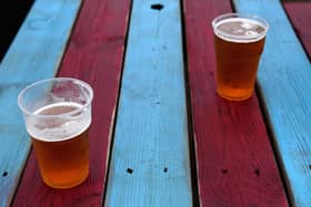 Beer is seen plastic cups prior to the Premier League match between West Ham United and Liverpool at London Stadium on November 4, 2017 in London, England.