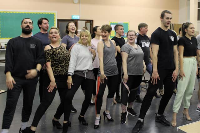 Some of the cast of Burnley Light Opera Society's 9 to 5 pictured in rehearsal