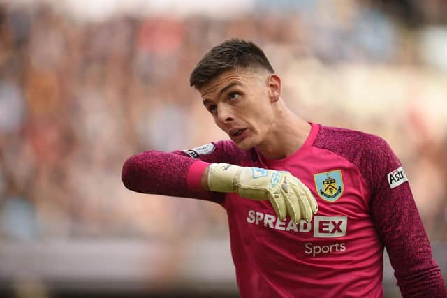 Burnley's English goalkeeper Nick Pope reacts during the English Premier League football match between Manchester City and Burnley at the Etihad Stadium in Manchester, north west England, on October 16, 2021.