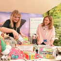 Burnley Together co-ordinator Nicola Larnach (right) andCalico Group employee Lisa Valentine sort through some of the donations already received for the Christmas present appeal.