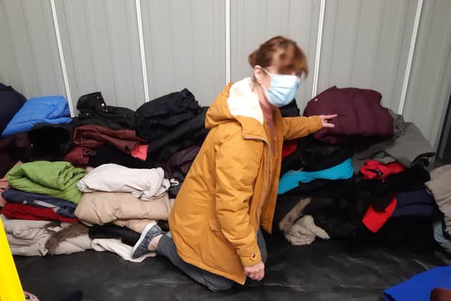 Heather with some of the donated coats