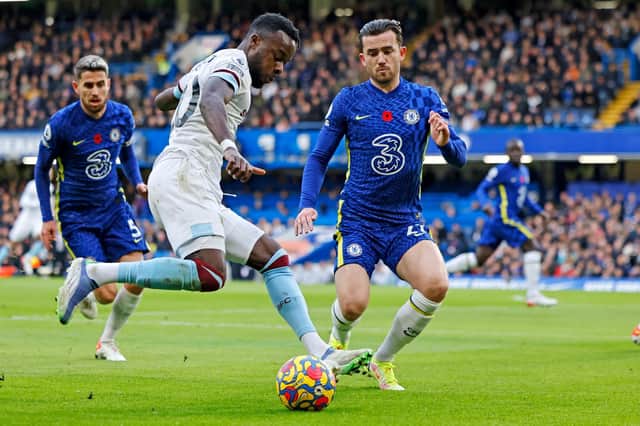 Burnley's Ivorian defender Maxwel Cornet (L) vies with Chelsea's English defender Ben Chilwell during the English Premier League football match between Chelsea and Burnley at Stamford Bridge in London on November 6, 2021.