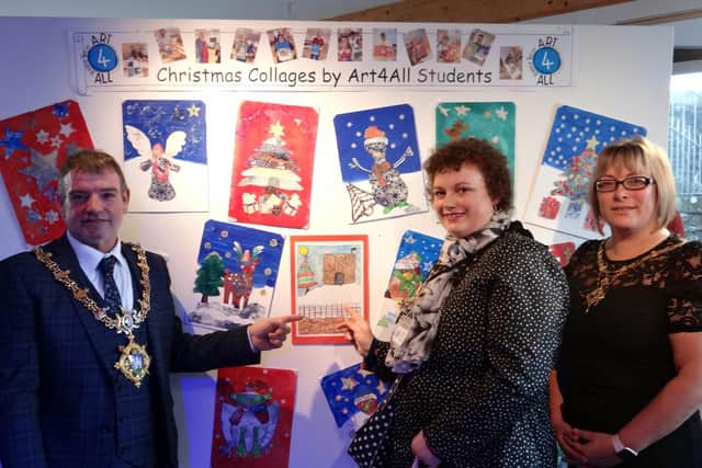Clitheroe Town Mayor Simon O'Rourke and Mayoress Donna are impressed with the images on show