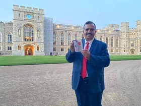 Coun. Mohammed Iqbal with his MBE at Windsor Castle