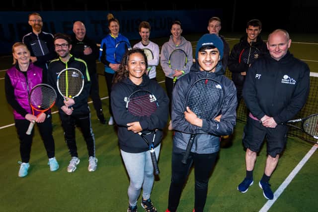 Tennis coach Imran Aswat (back row, far right) with members of Burnley Tennis Club  who may soon be able to take advantage of indoor courts