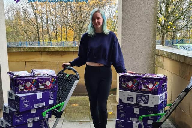 Paige with the selection boxes she has bought for children in hospital on Christmas Day