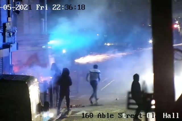 A police appeal has been launched to identify a number of youths who were caught on CCTV throwing fireworks, and a brick, at two fire engines in Burnley.