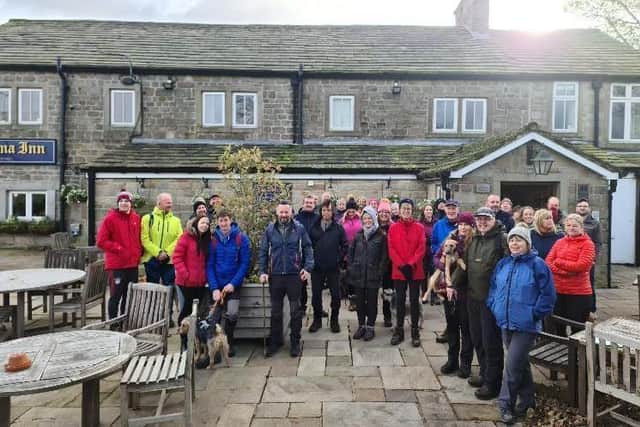 Walkers assembled outside the Alma Inn