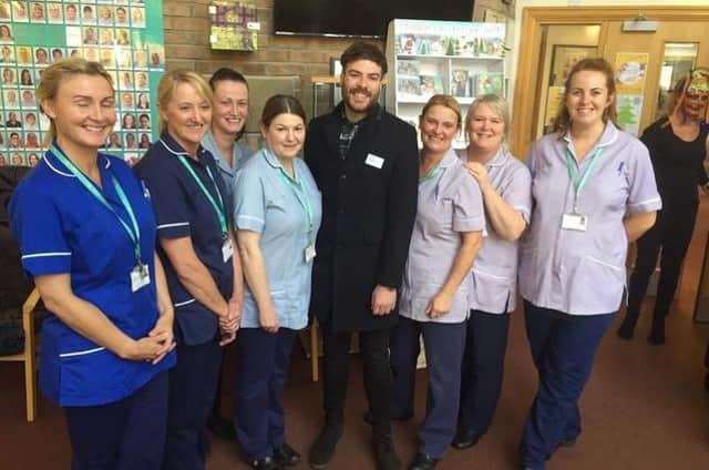 Jordan North with some of the staff at Pendleside Hospice where he is a celebrity ambassador