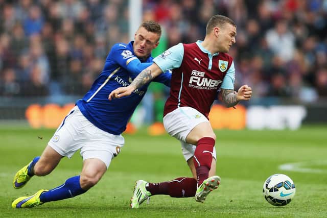 Jamie Vardy of Leicester City and Kieran Trippier of Burnley compete for the ball during the Barclays Premier League match between Burnley and Leicester City at Turf Moor on April 25, 2015 in Burnley, England.