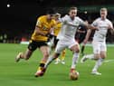 Raul Jimenez of Wolverhampton Wanderers battles for possession with Charlie Taylor of Burnley during the Premier League match between Wolverhampton Wanderers and Burnley at Molineux on December 01, 2021 in Wolverhampton, England.