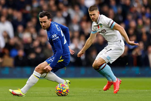 Chelsea's English defender Ben Chilwell (L) vies with Burnley's Icelandic midfielder Johann Berg Gudmundsson during the English Premier League football match between Chelsea and Burnley at Stamford Bridge in London on November 6, 2021.