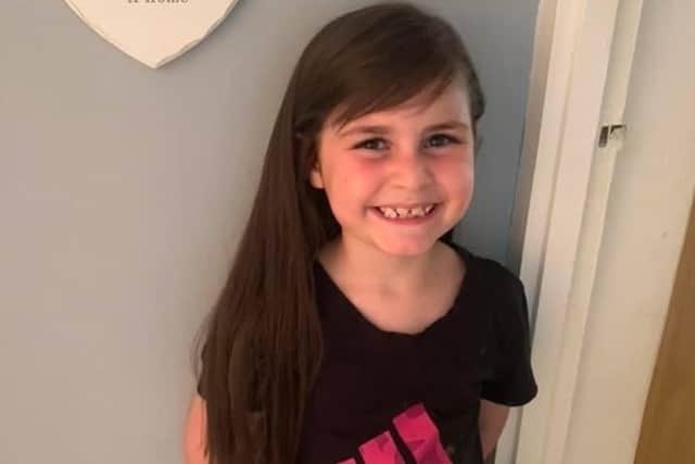 Lola Addis (seven) is raising money for a charity in her great grandad's memory by having her long hair cut