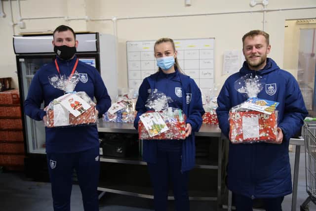 (Left to right) Nathan Norris, Burnley FC in the Community Kitchen assistant manager, Olivia Wilson, and Josh Dunne, Burnley FC in the Community Kitchen driver.
