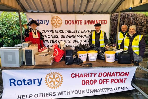 Clitheroe Town Crier Roland Hailwood at the Rotary stall which saw people donate thousands of items for the underprivileged