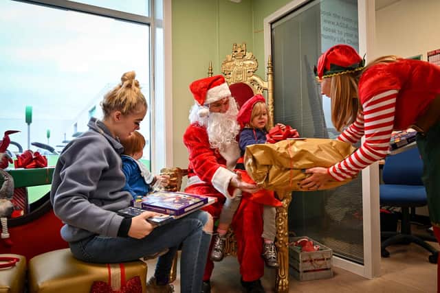 Santa and his elves meet local children