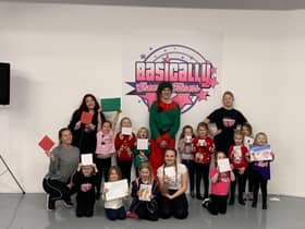 Some of the mini stars cheerleading team, who are aged four to six, from Basically Cheer and Fitness, with their Christmas cards and pictures, along with dance school owner Lianne Bruce and four junior coaches, Annie Fort, Dylan Wood, Georgina Dixon-Fewster and Maddison Pickles