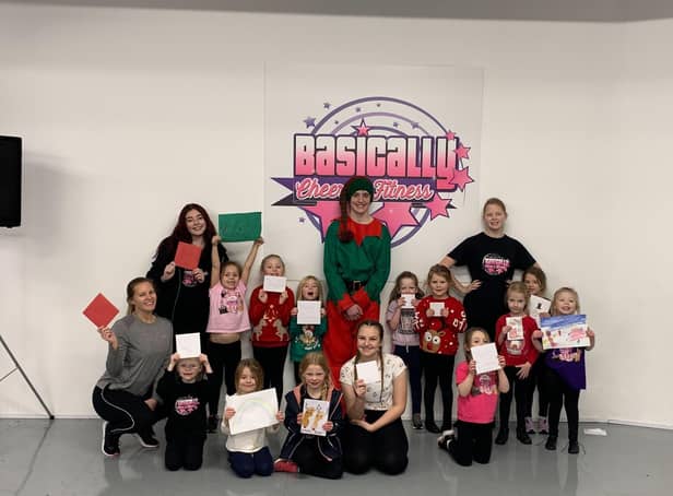 Some of the mini stars cheerleading team, who are aged four to six, from Basically Cheer and Fitness, with their Christmas cards and pictures, along with dance school owner Lianne Bruce and four junior coaches, Annie Fort, Dylan Wood, Georgina Dixon-Fewster and Maddison Pickles