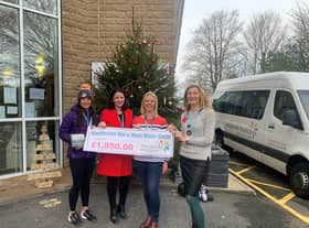 Photo left to right: Vanessa Holland, Ann-Marie Stockwell, Kathryn Calverley and Lesley Baxendale hand over a cheque for £1,850 to Pendleside Hospice the cash they raised in memory of their friend Lindsay Sharples.