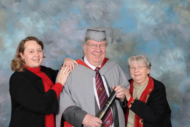 Peter receiving an honorary fellowship fromUCLan in 2011 with his wife Sheila and daughter Carol