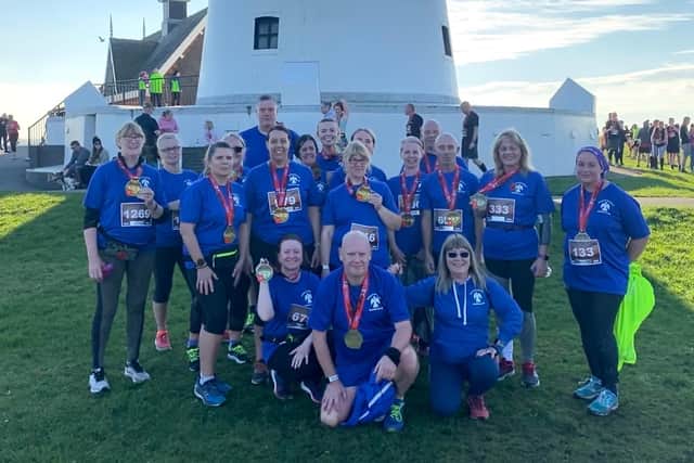 Karly's Angels running club celebrate taking part in the Lytham Remembrance Sunday 10k run