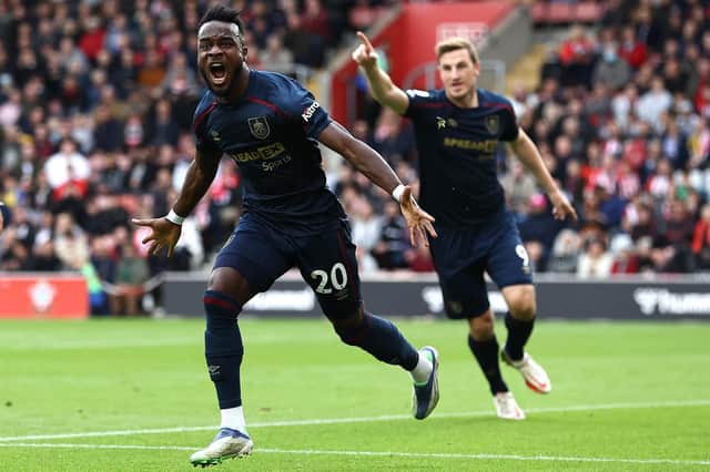 Maxwel Cornet of Burnley celebrates after scoring his teams first goal during the Premier League match between Southampton and Burnley at St Mary's Stadium on October 23, 2021 in Southampton, England.
