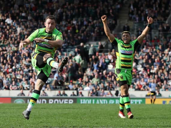 Stephen Myler booted the ball out to seal Saints' win at Welford Road, much to the delight of Luther Burrell