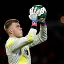 MANCHESTER, ENGLAND - DECEMBER 21: Bailey Peacock-Farrell of Burnley warms up prior to the Carabao Cup Fourth Round match between Manchester United and Burnley at Old Trafford on December 21, 2022 in Manchester, England. (Photo by Lewis Storey/Getty Images)
