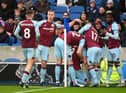 BRIGHTON, ENGLAND - FEBRUARY 19: Wout Weghorst of Burnley celebrates with team mates after scoring their side's first goal during the Premier League match between Brighton & Hove Albion and Burnley at American Express Community Stadium on February 19, 2022 in Brighton, England. (Photo by Mike Hewitt/Getty Images)
