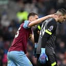 BURNLEY, ENGLAND - APRIL 13: Arijanet Muric of Burnley is consoled by his teammate Maxime Esteve after scoring an own goal during the Premier League match between Burnley FC and Brighton & Hove Albion at Turf Moor on April 13, 2024 in Burnley, England. (Photo by Gareth Copley/Getty Images) (Photo by Gareth Copley/Getty Images)