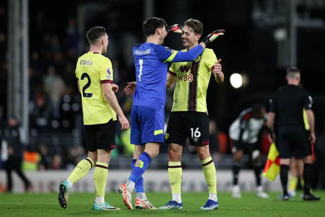 LONDON, ENGLAND - DECEMBER 23: Dara O'Shea, James Trafford and Sander Berge of Burnley celebrate victory at full-time following the Premier League match between Fulham FC and Burnley FC at Craven Cottage on December 23, 2023 in London, England. (Photo by Steve Bardens/Getty Images)